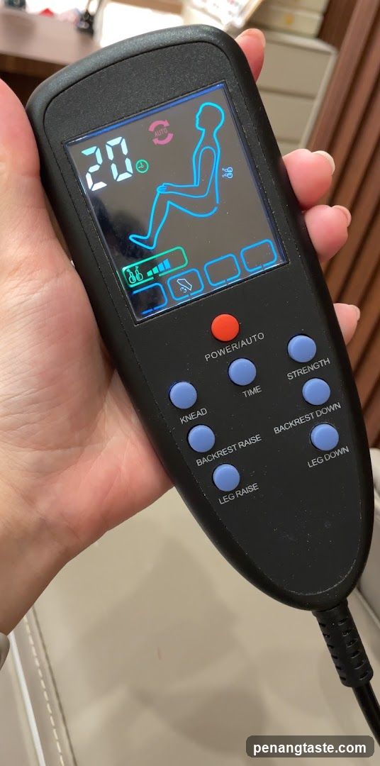 Hand holding a control panel