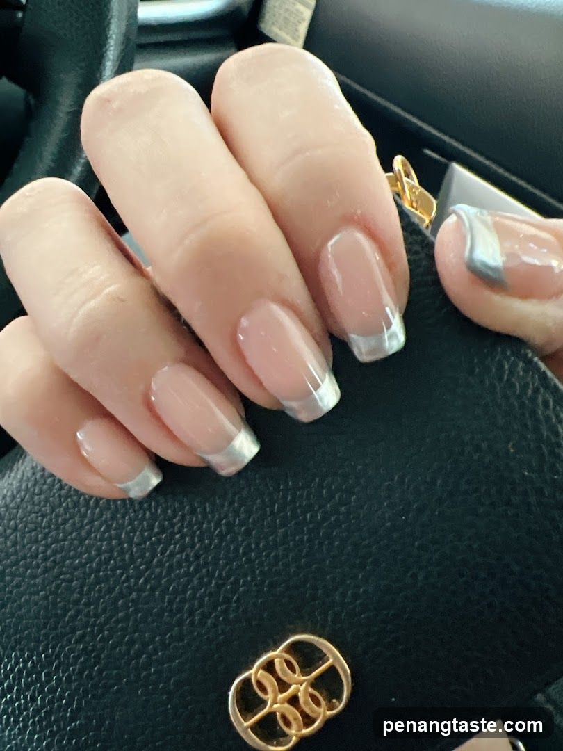 Hand with manicure on car interior