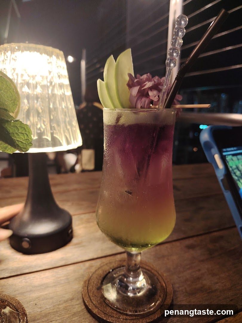 Cocktail on wooden table at night