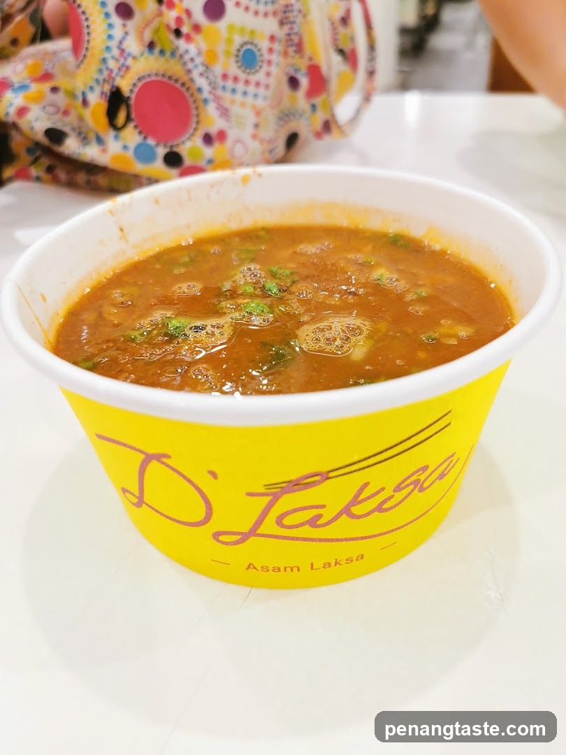 Asam Laksa in a branded cup