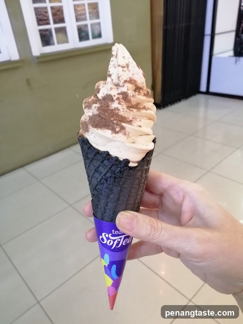 Hand holding ice cream cone