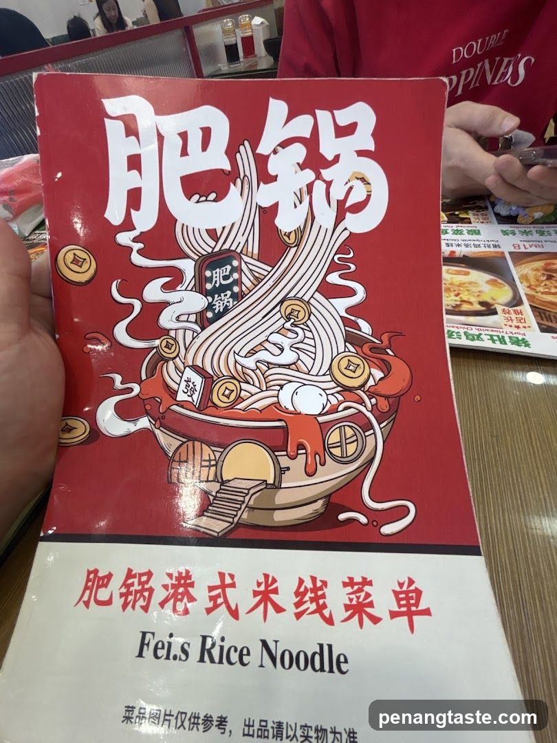 Hand holding menu at restaurant
