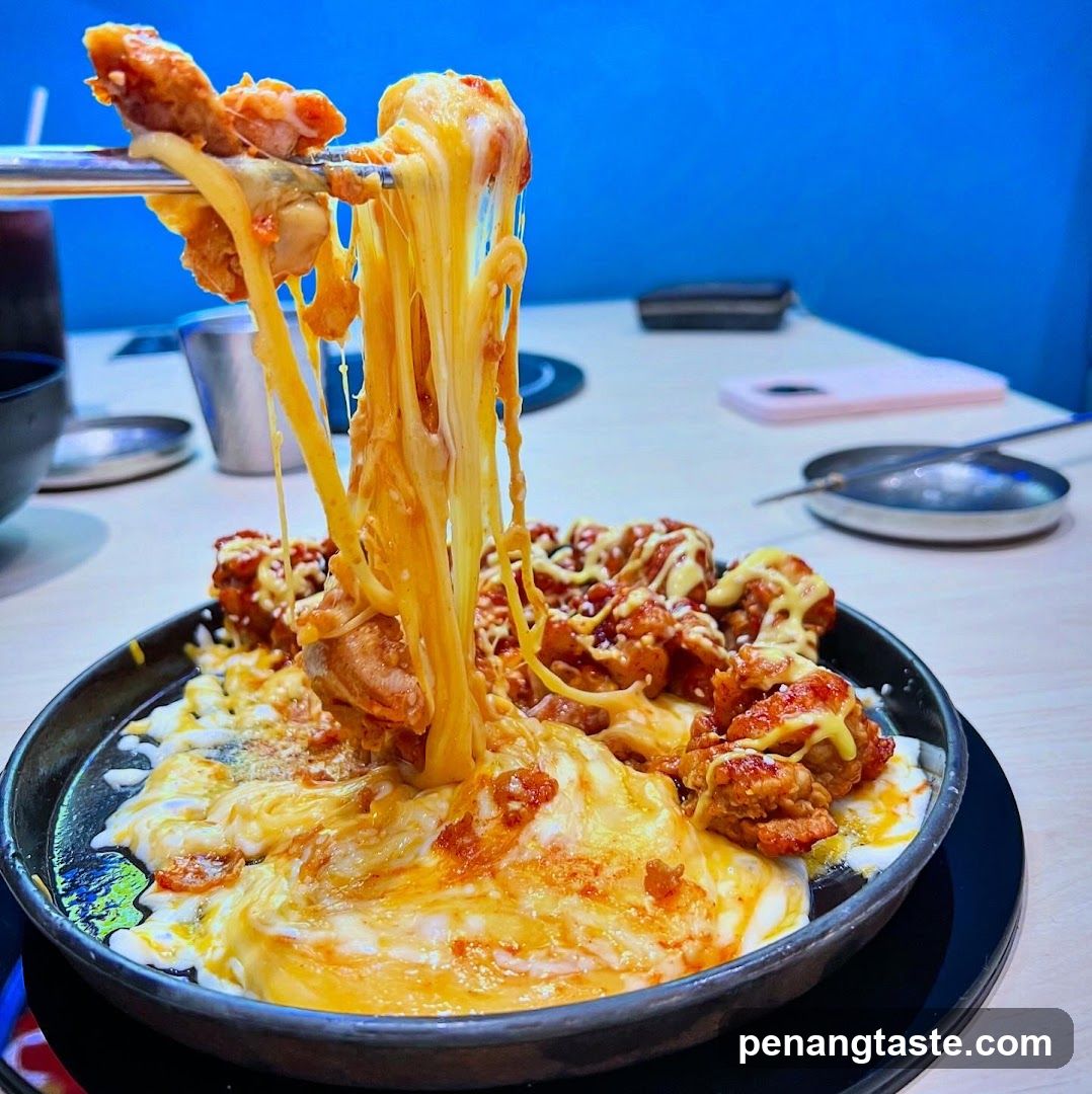 Cheese-covered fried chicken dish