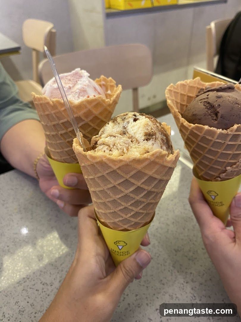 Ice Cream Cones Held in Hands