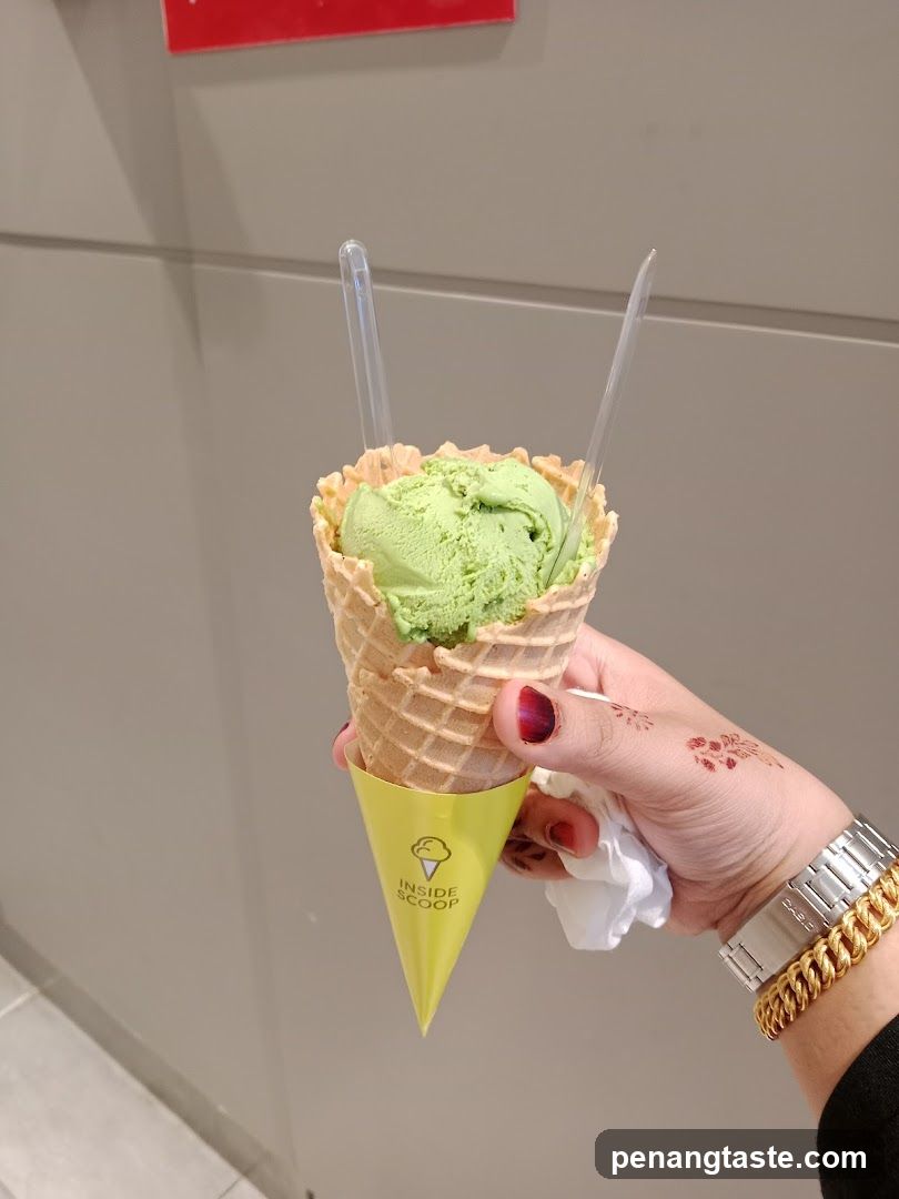 Hand holding ice cream cone