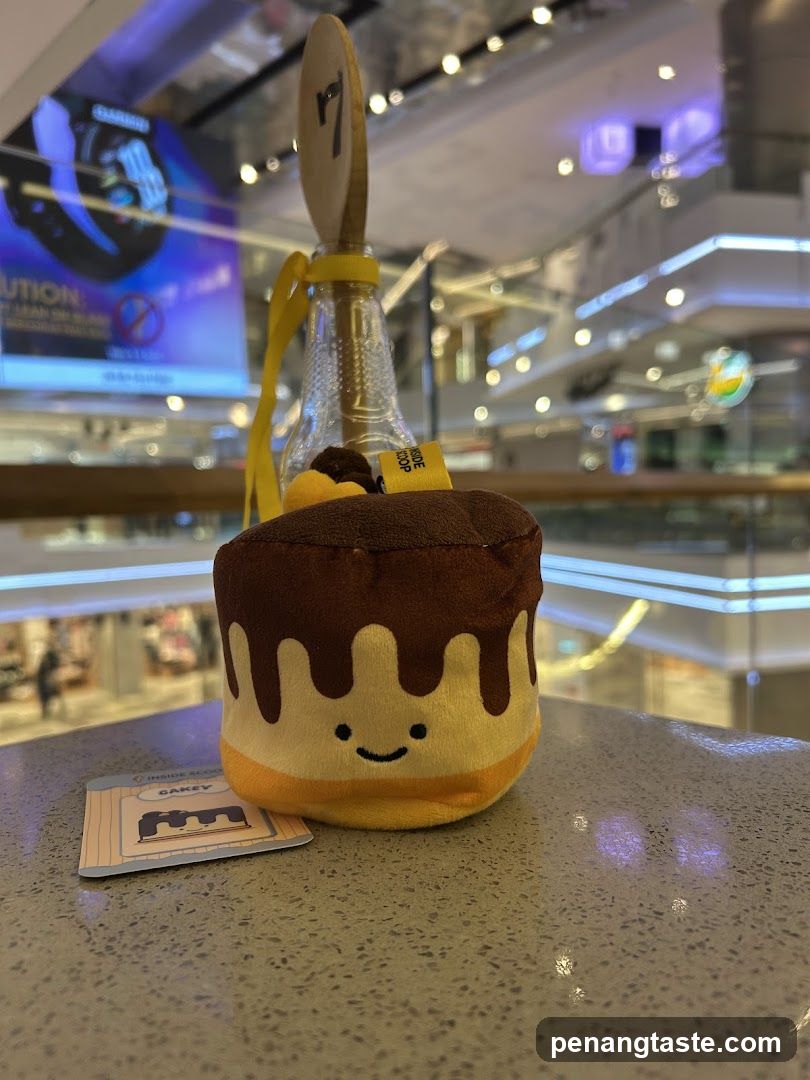 Plush toy and branded merchandise on counter