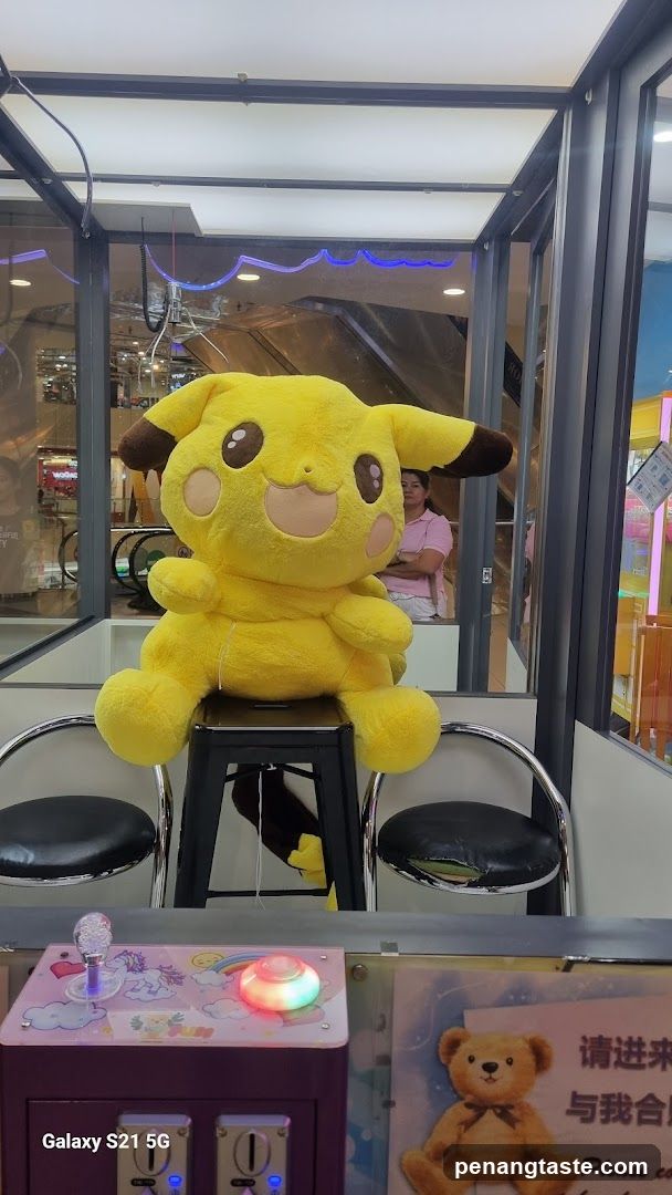 Pikachu plush in claw machine