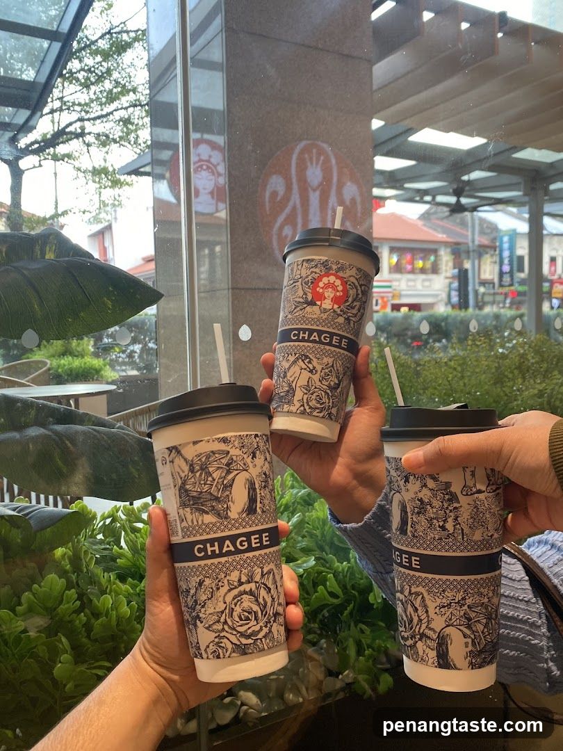Chagee Coffee Cups Held Up