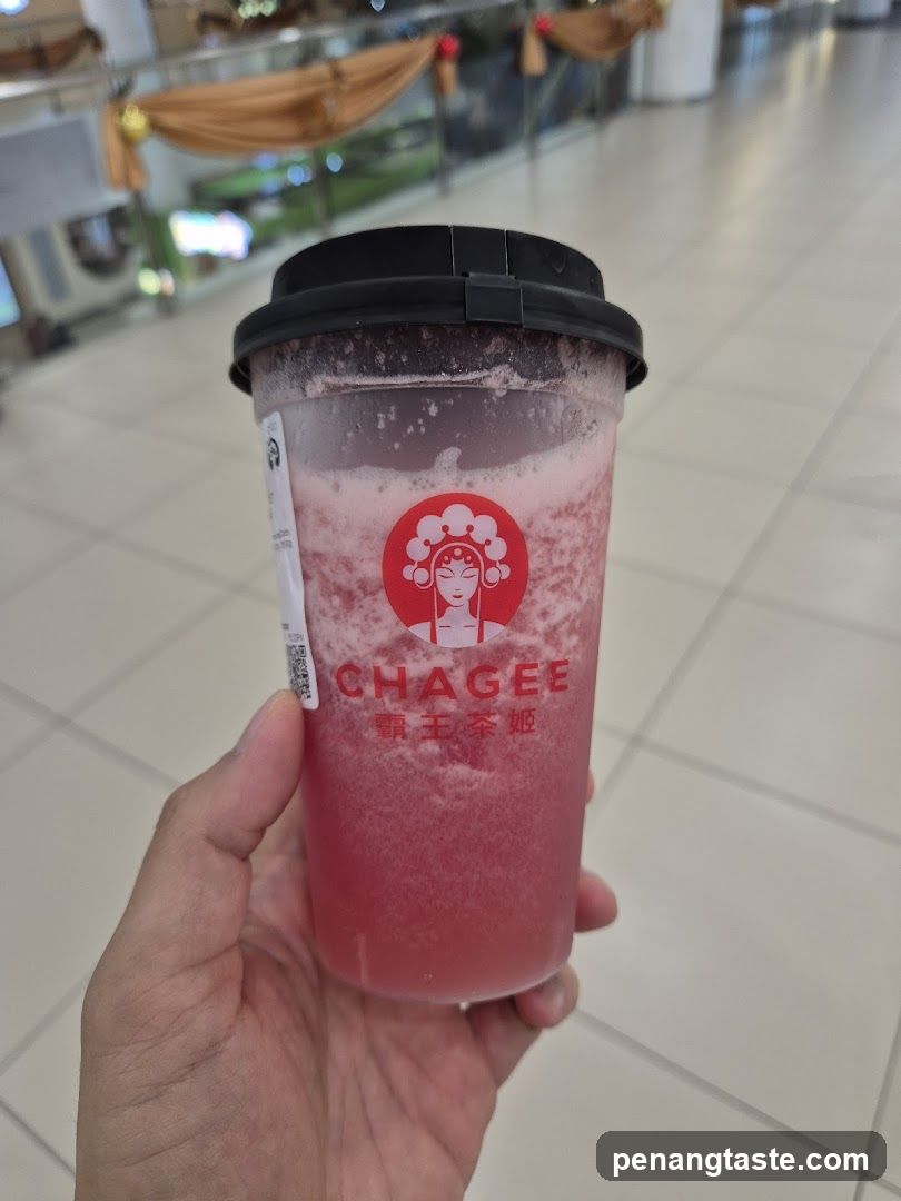 Hand holding Chagee drink