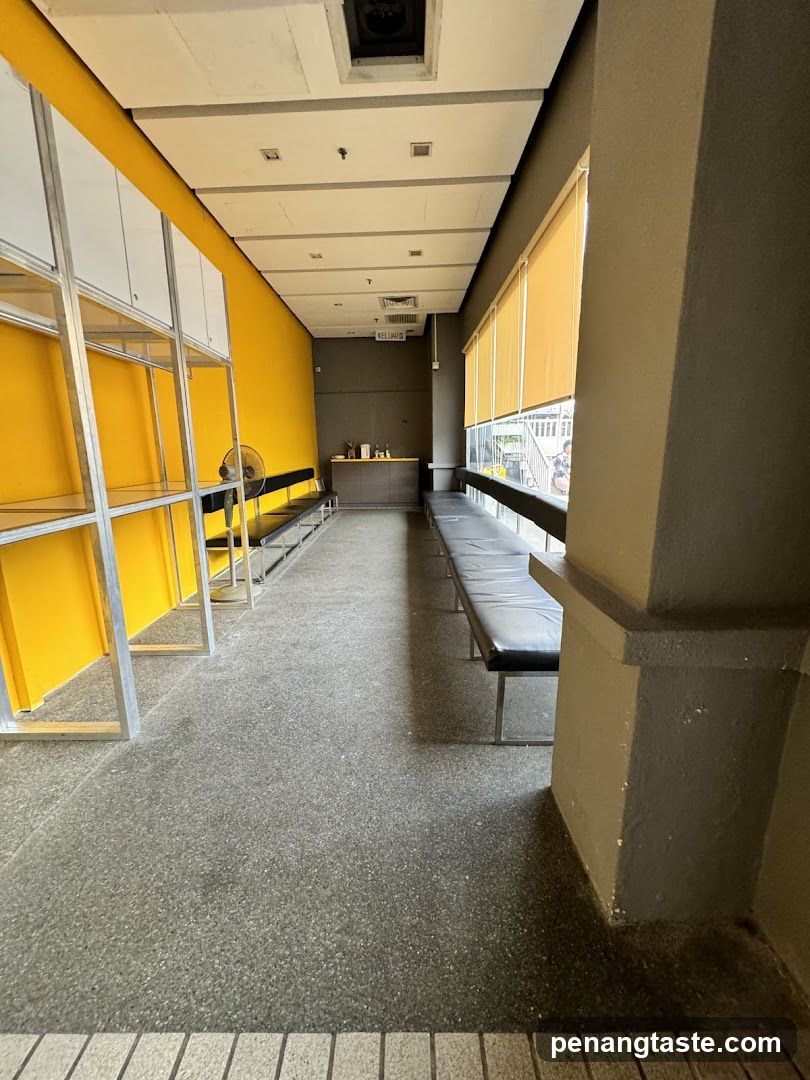 Interior hallway with yellow walls and seating