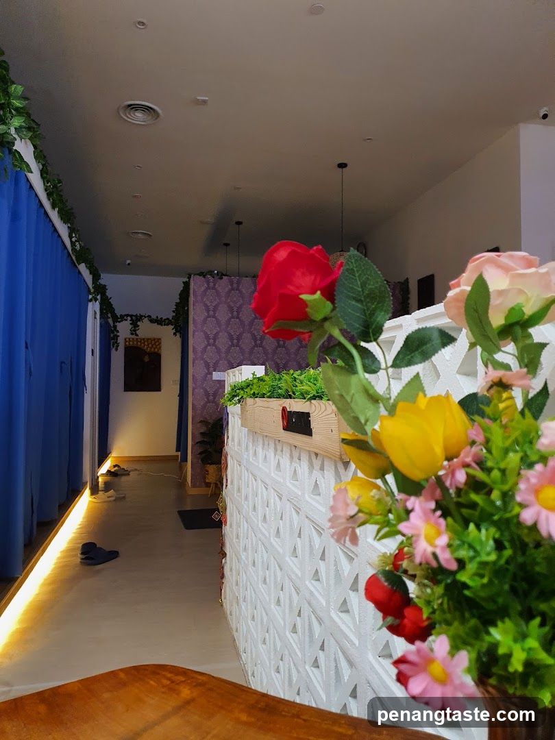 Interior with floral display and blue curtains