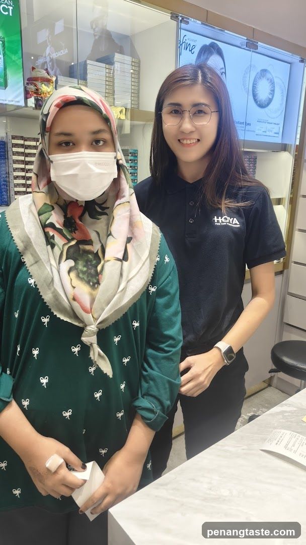 Interior of an optical store with staff and customer
