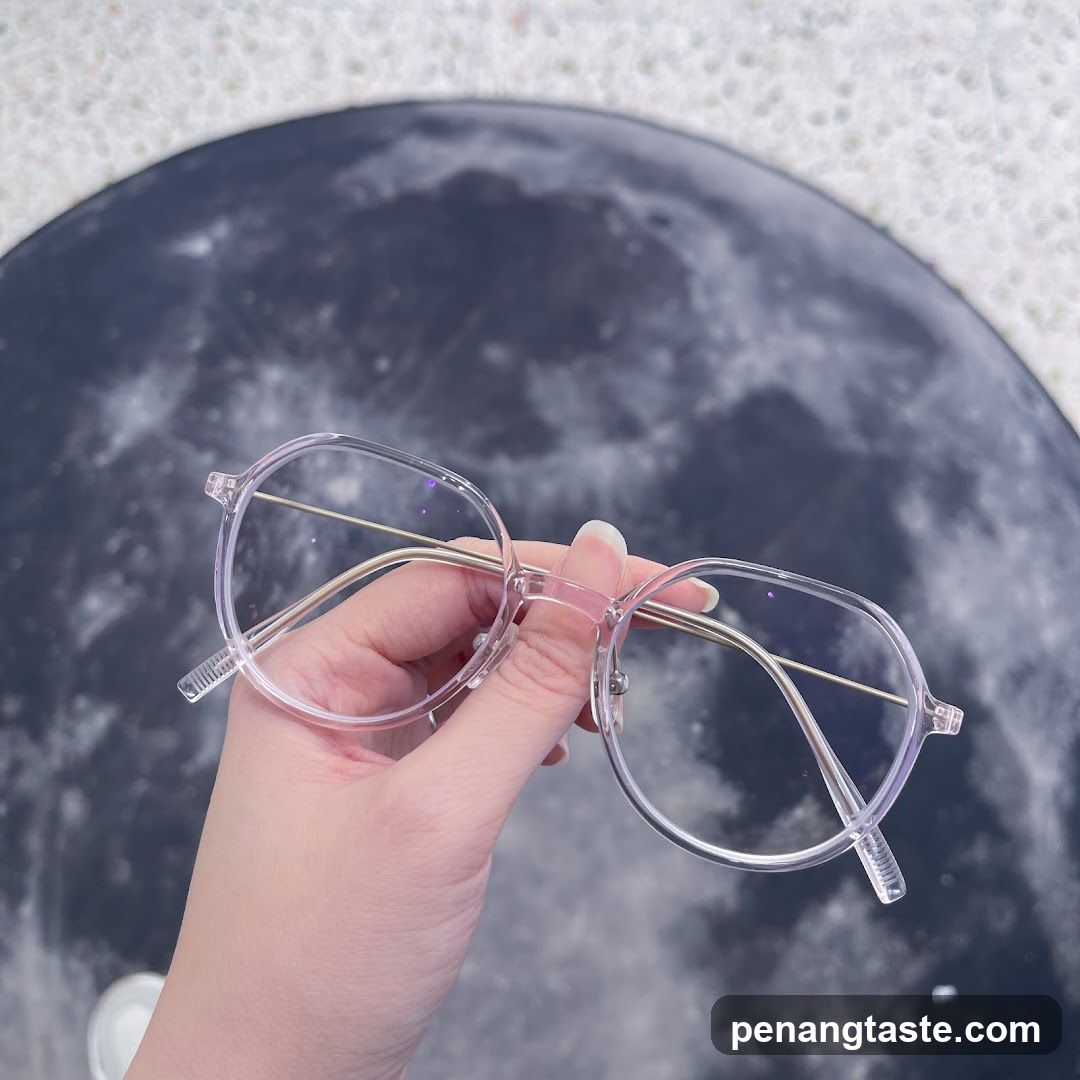 Clear Glasses Held in Hand
