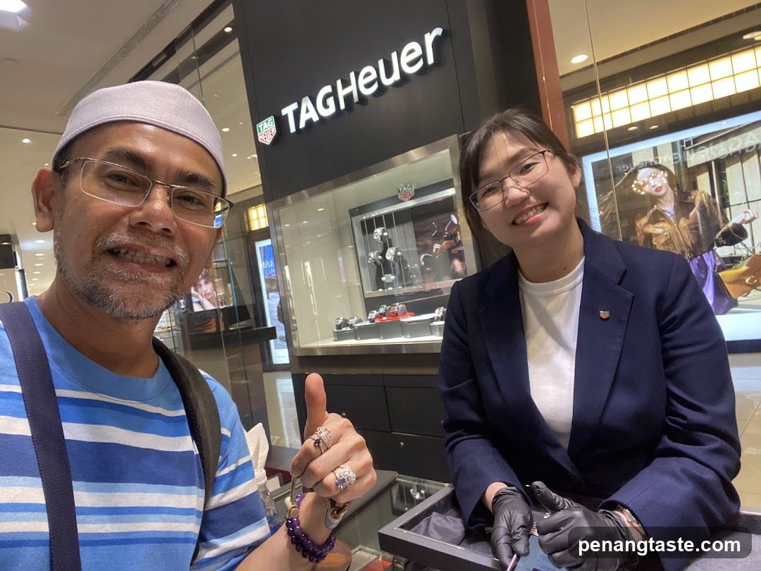 TAG Heuer Store Interior with Staff and Customer