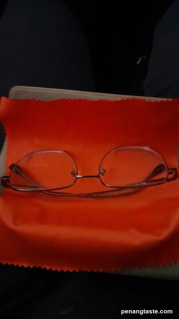 Glasses on Orange Cloth
