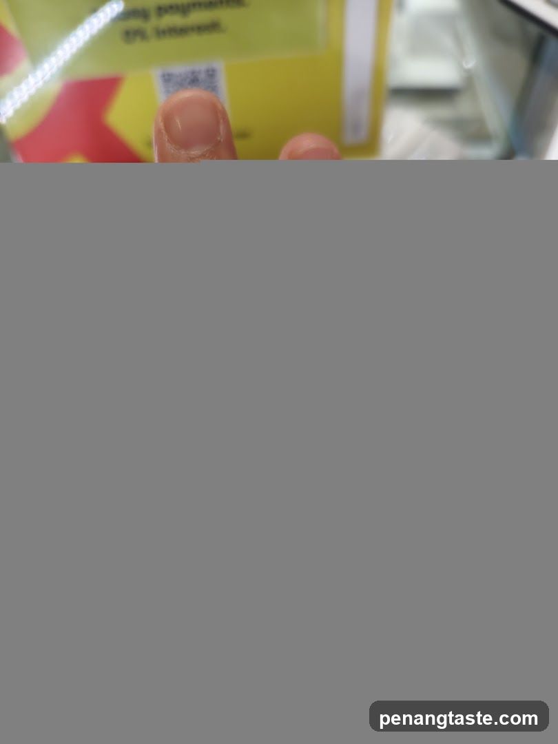 Finger pointing at yellow sign