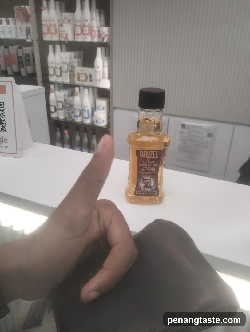 Reuzel Hair Oil Bottle on Counter