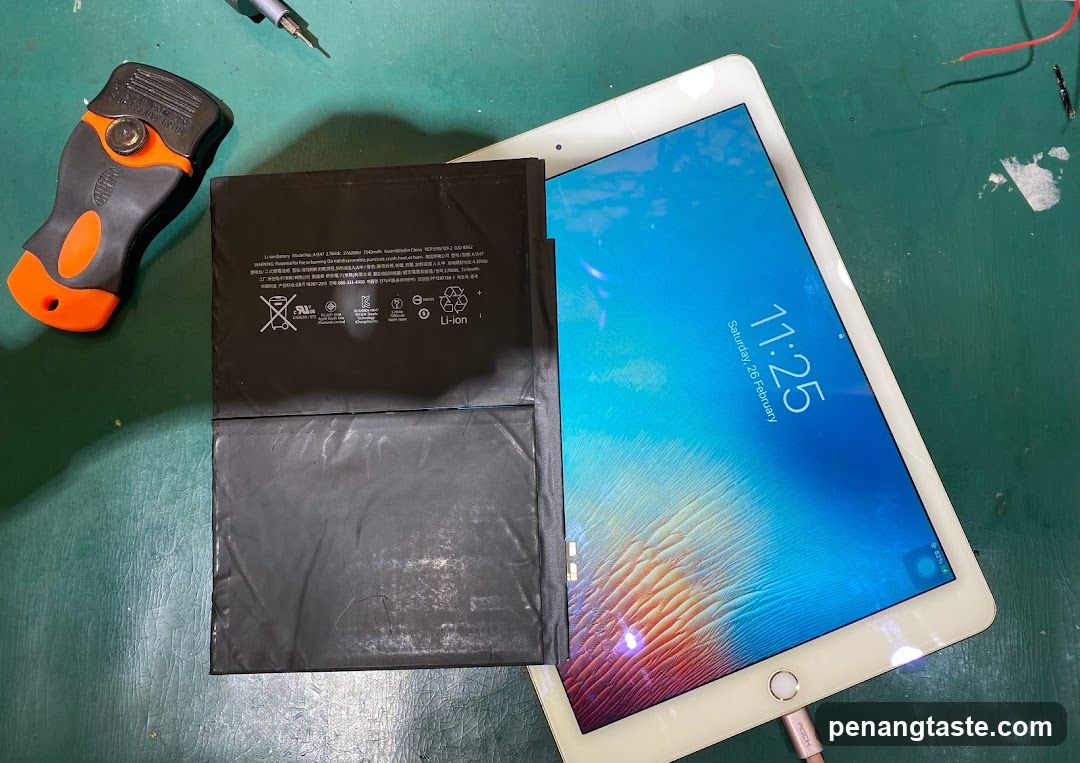 Disassembled iPad with Battery and Tools