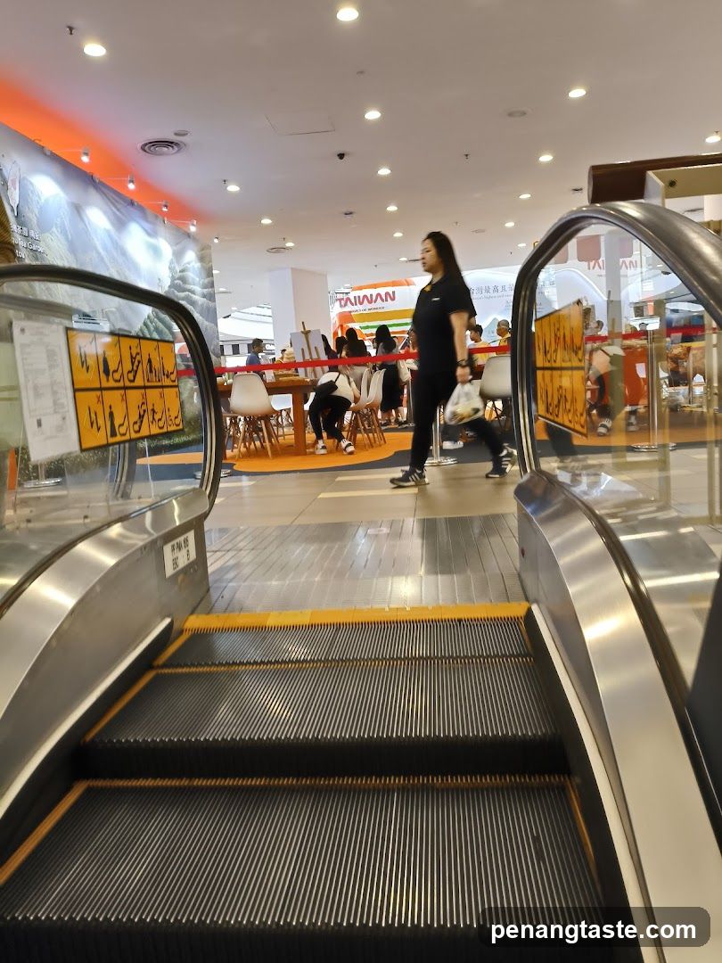 Shopping Mall Interior with Escalator and Event Booth
