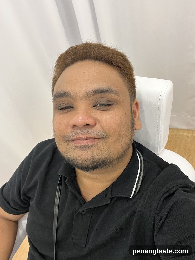 Selfie of a man in black polo shirt