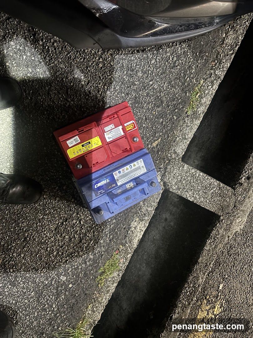 Car Batteries on Asphalt