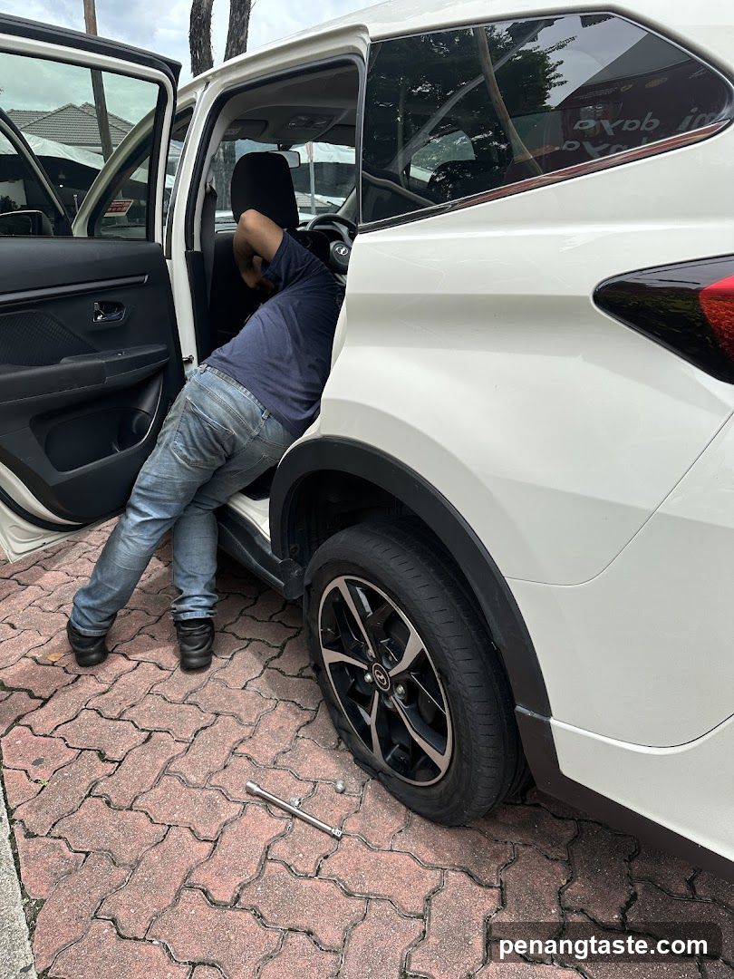 Mechanic Working on Car