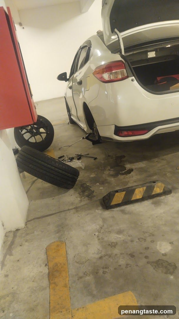 Car in garage with tire removed