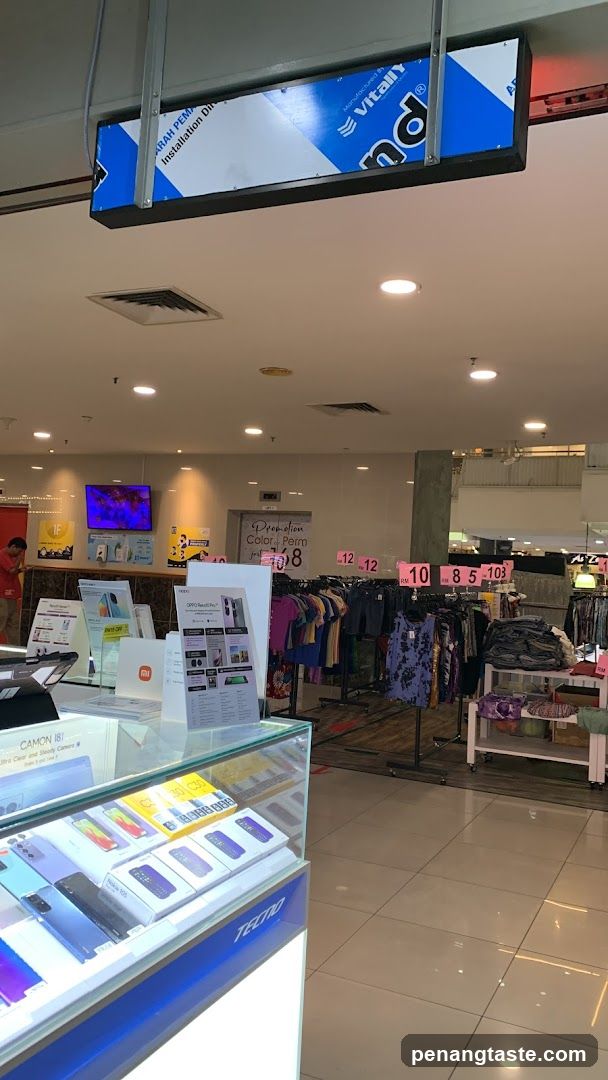 Interior of a retail store with clothing and electronics display