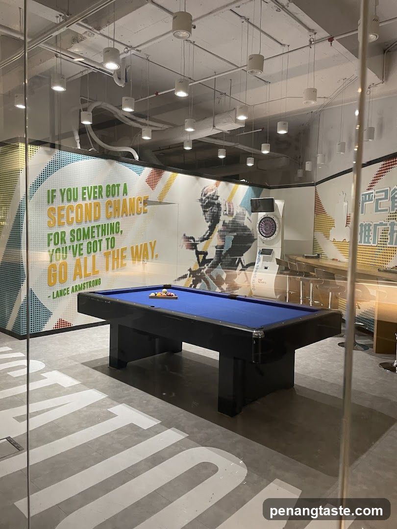 Indoor recreational area with pool table and motivational wall art
