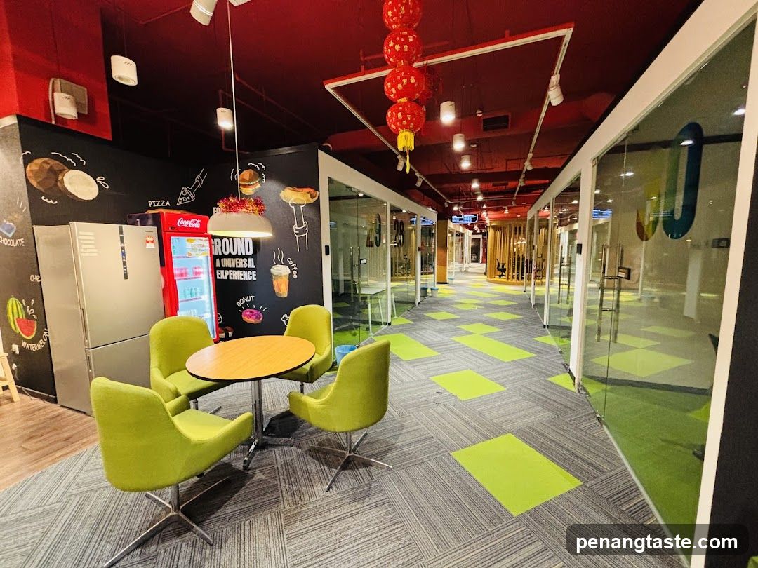 Modern Cafeteria Interior with Red Ceiling and Green Seating