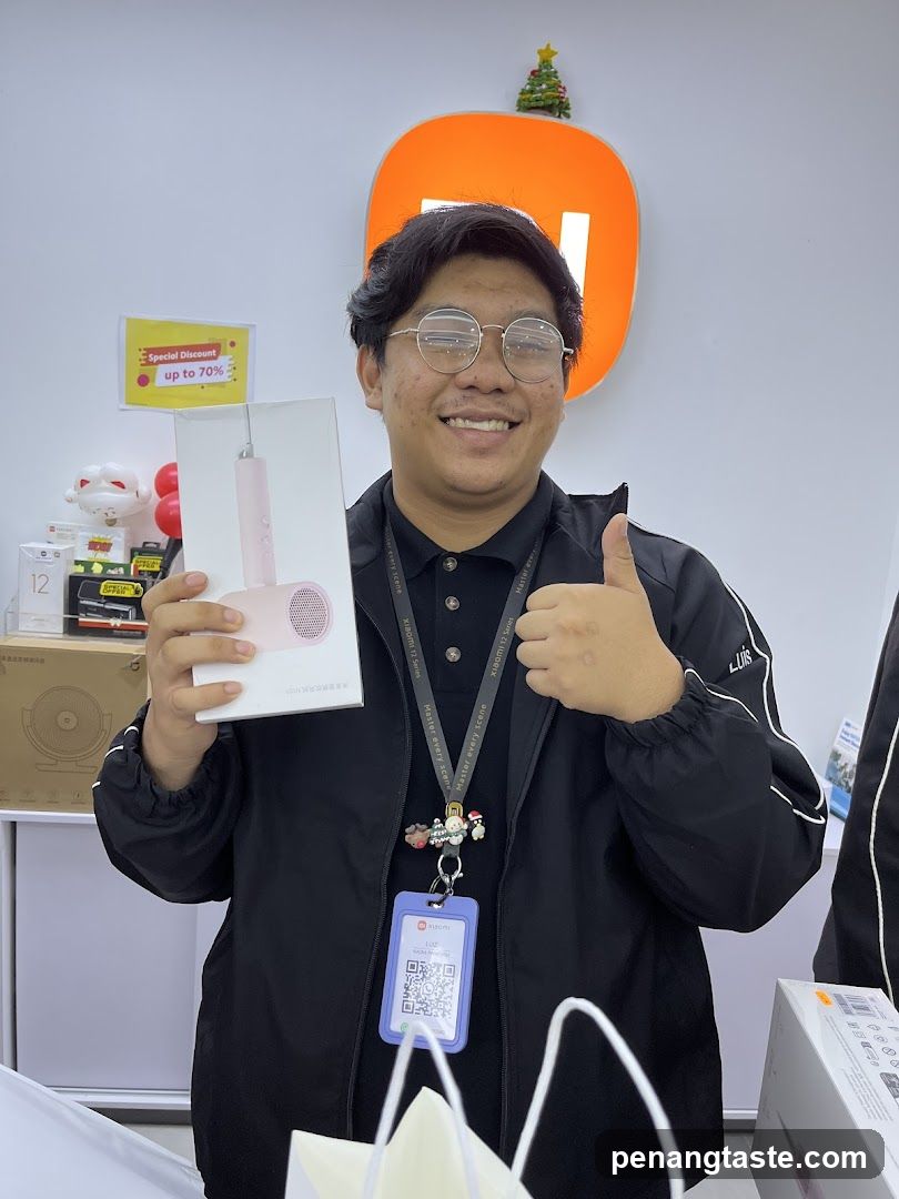Staff holding product box in store