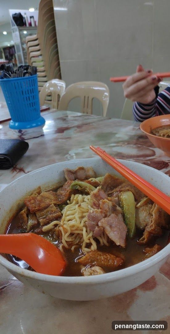 Noodle Bowl with Chopsticks and Spoon