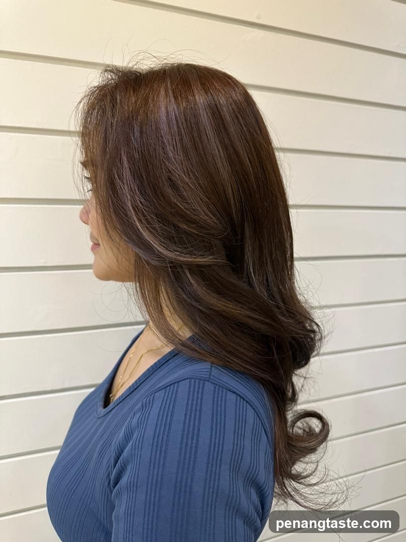 Woman with long brown hair in profile