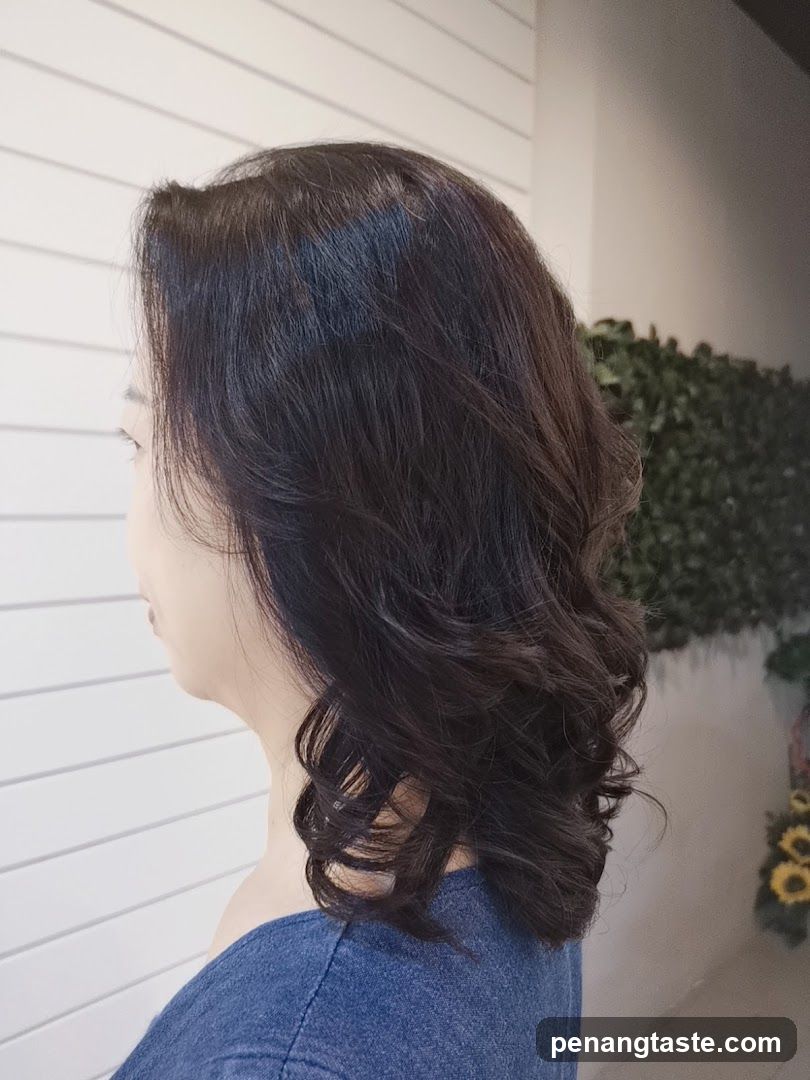 Woman with wavy dark hair in profile view