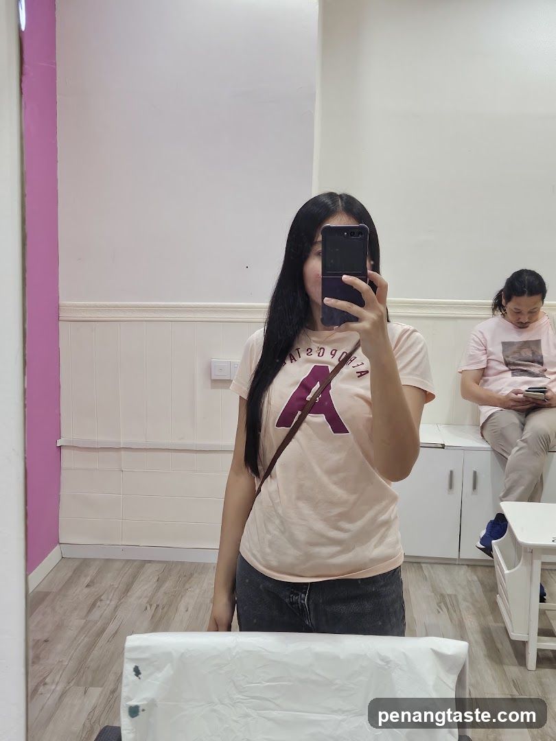 Mirror selfie in a salon or beauty shop interior