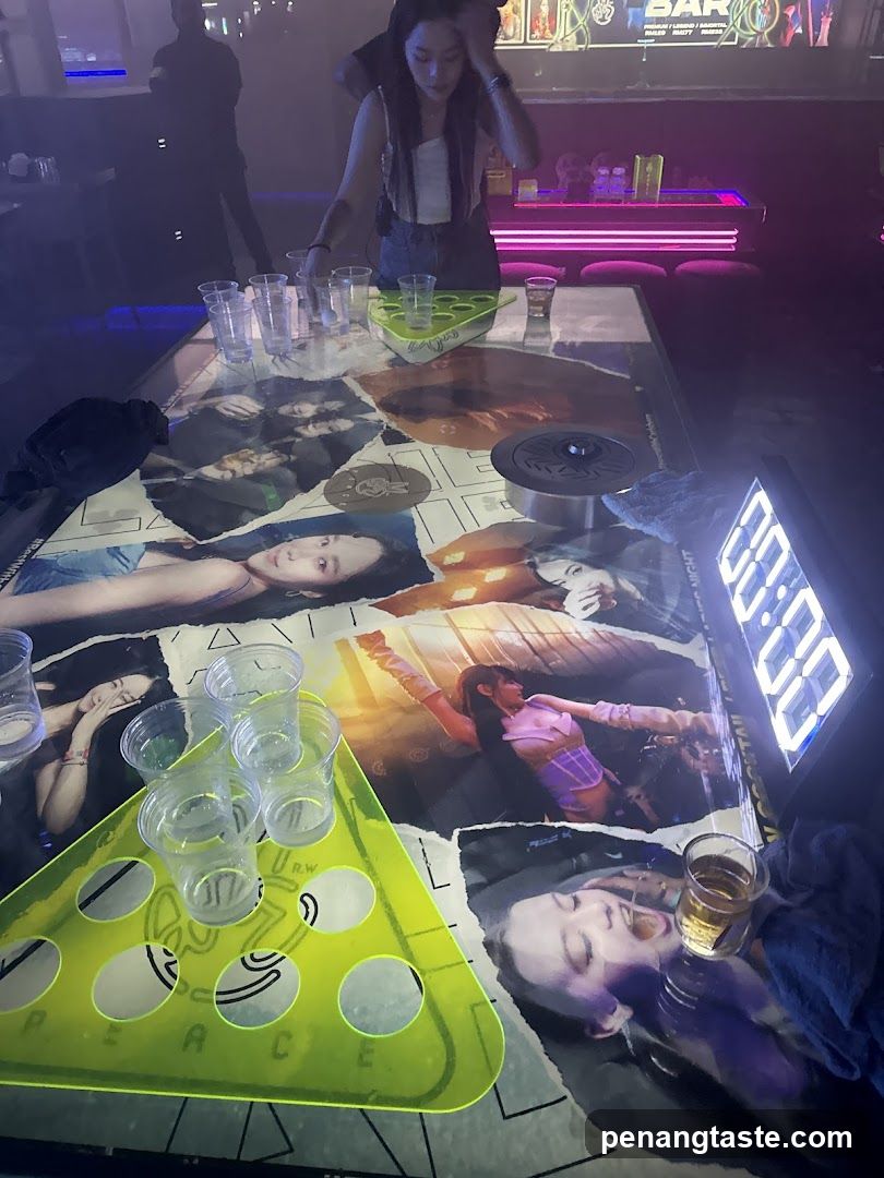 K-pop themed bar interior with beer pong game