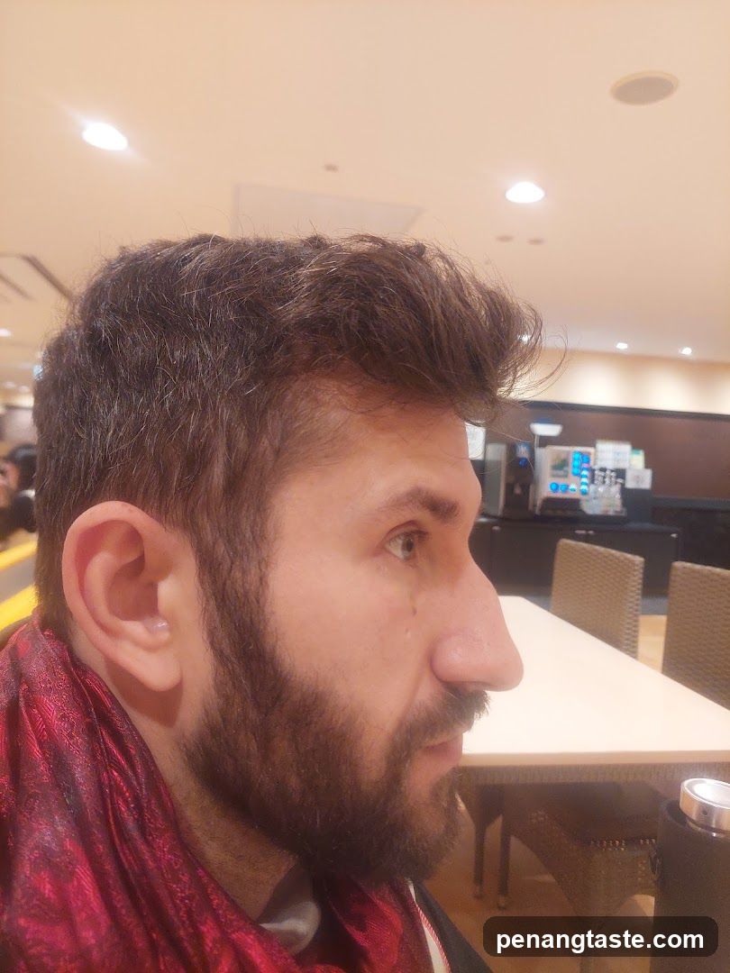 Man in Red Scarf at Coffee Shop Interior