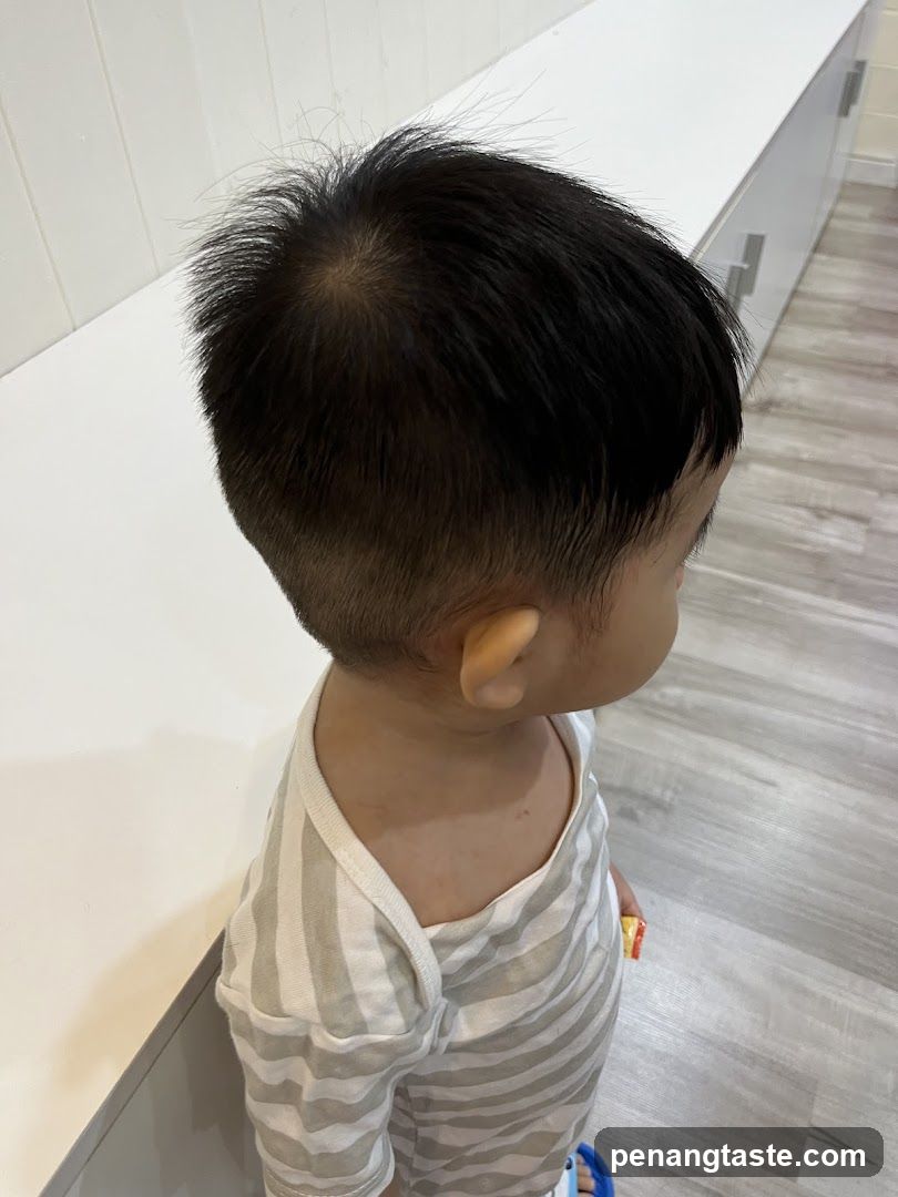 Child with short hair indoors