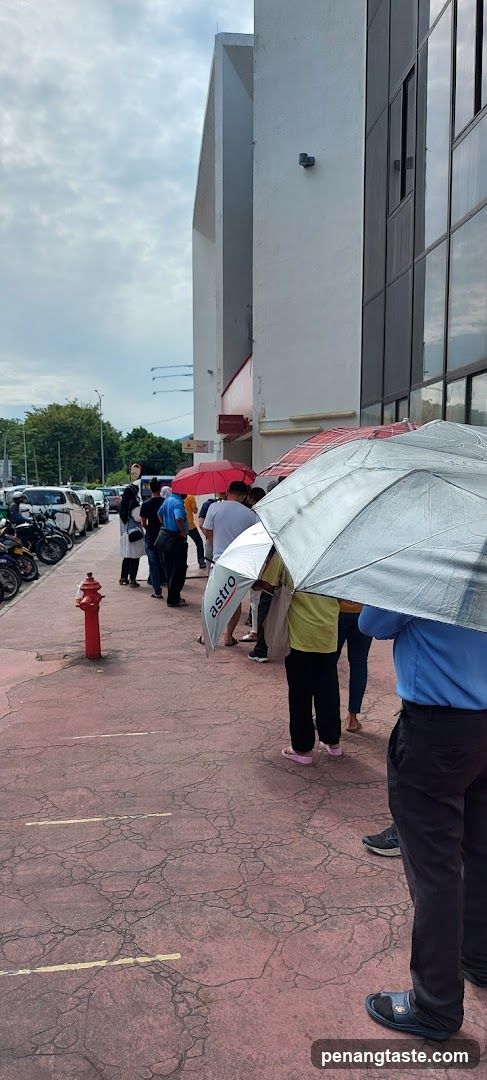 People Queuing Outside Building