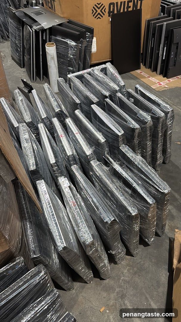 Stacked Flat-Screen Monitors in Warehouse