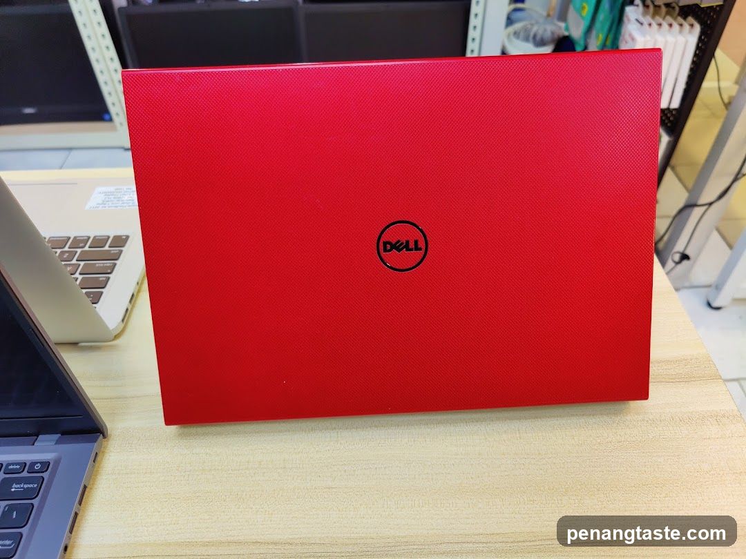 Red Dell Laptop on Desk