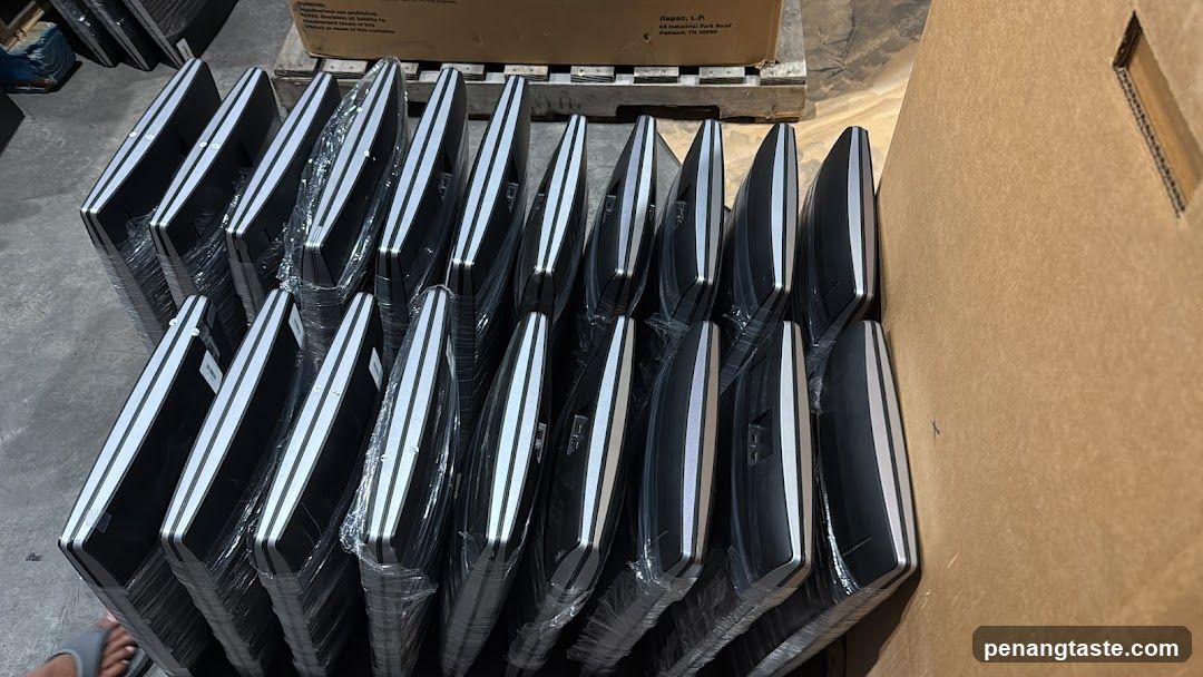 Stacked Laptops in Warehouse