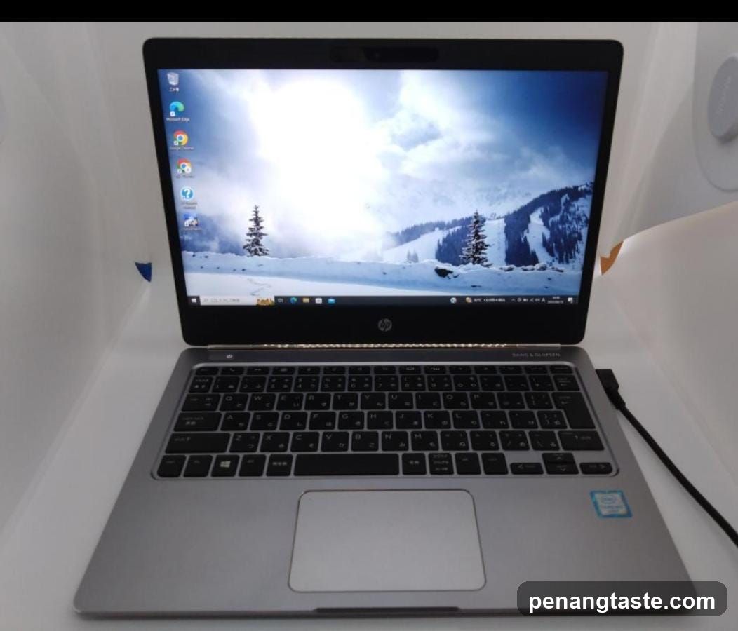 HP Laptop on White Surface
