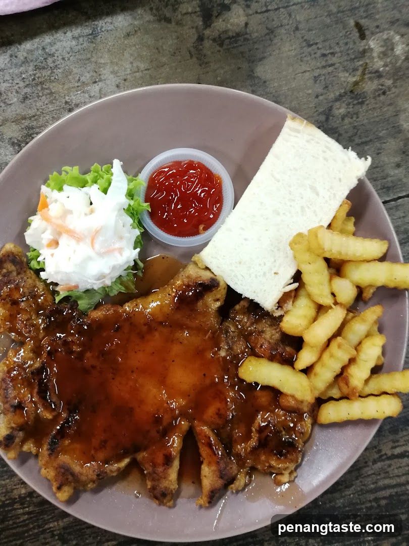 Plate of Fried Chicken with Fries and Salad