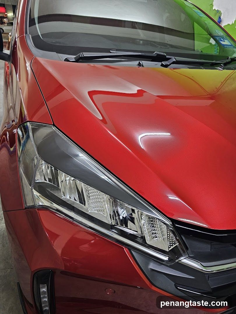 Red Car Hood and Headlight Detail