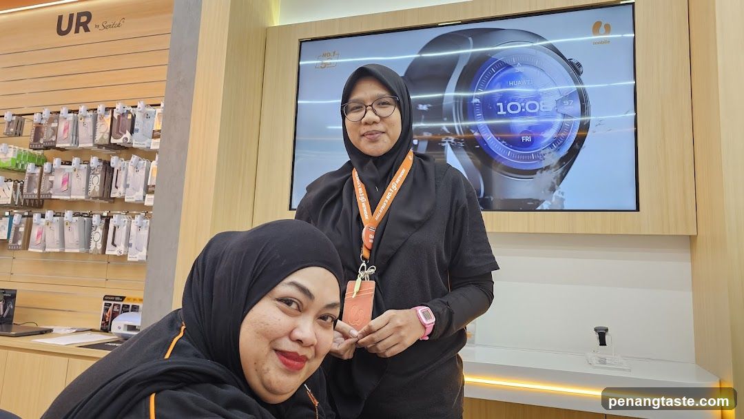 Store Interior with Staff and Display Screen