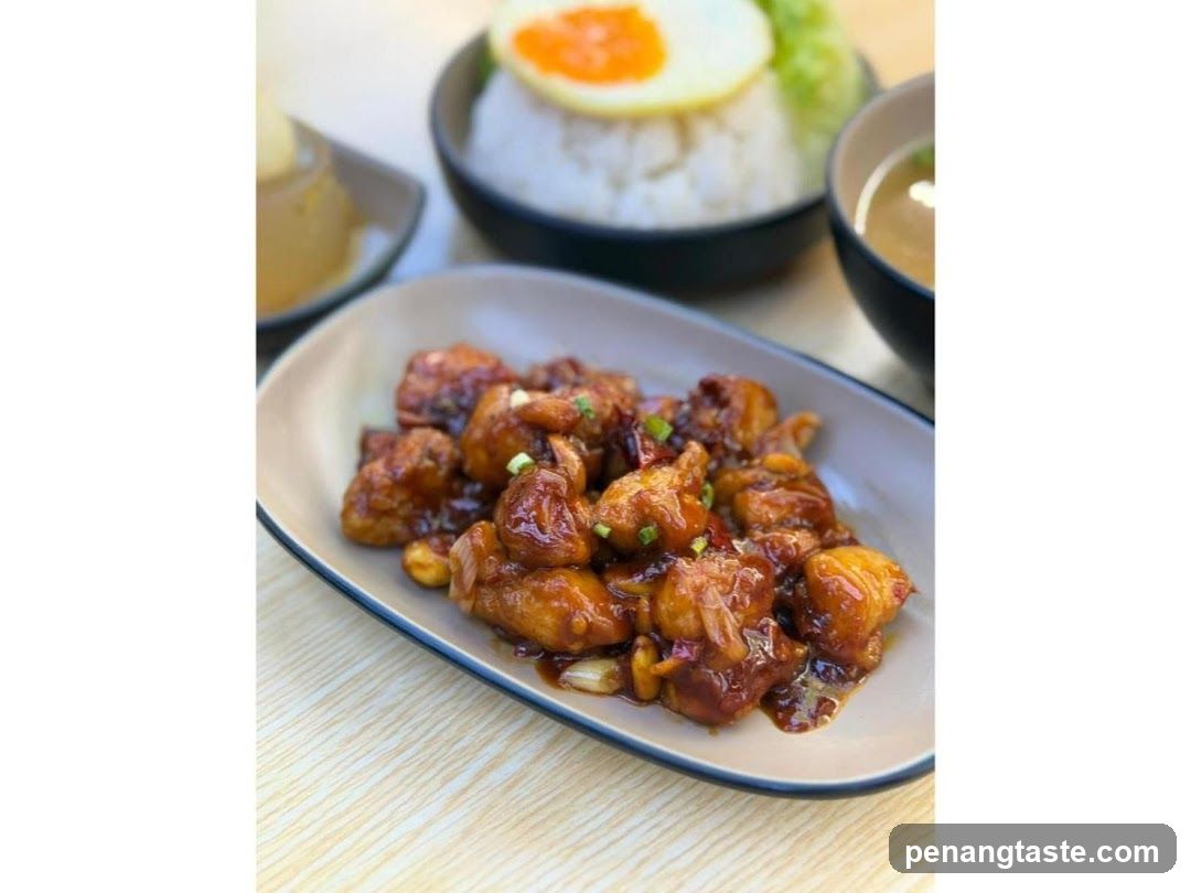 Sauced Chicken Dish with Side Bowls