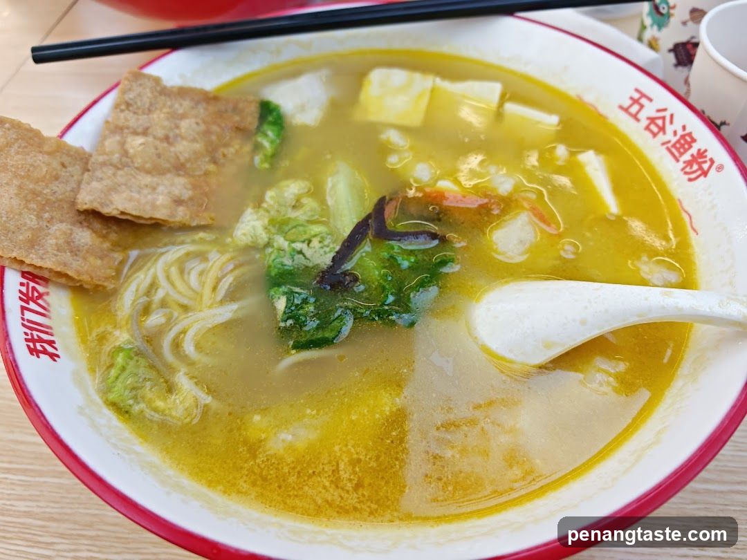 Bowl of Noodle Soup with Crispy Tofu Skin and Vegetables