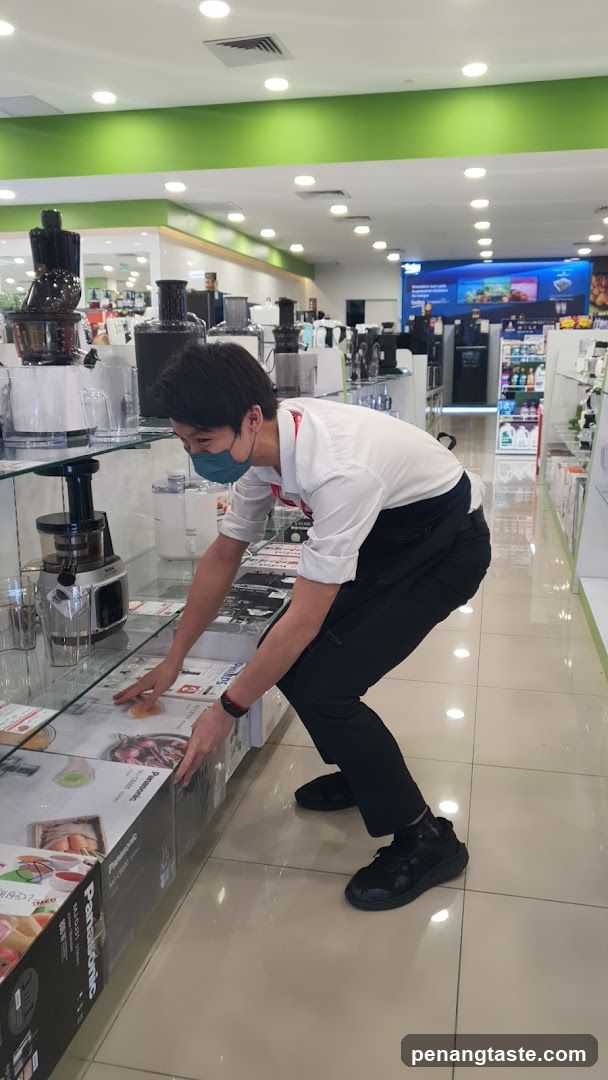 Store Interior with Staff Arranging Products