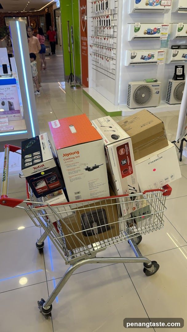 Shopping Cart with Electronics Boxes in Store